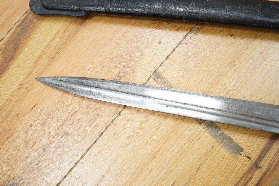 A First World War Turkish army officer’s sword, with pipe back blade, regulation iron guard pierced with crescent and moon, chequered horn grips, in its iron scabbard, together with an unidentified bayonet in its scabbar